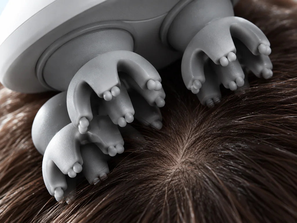 An extreme macro photograph of the exact grey silicone head clusters from the Nuage reference, showi