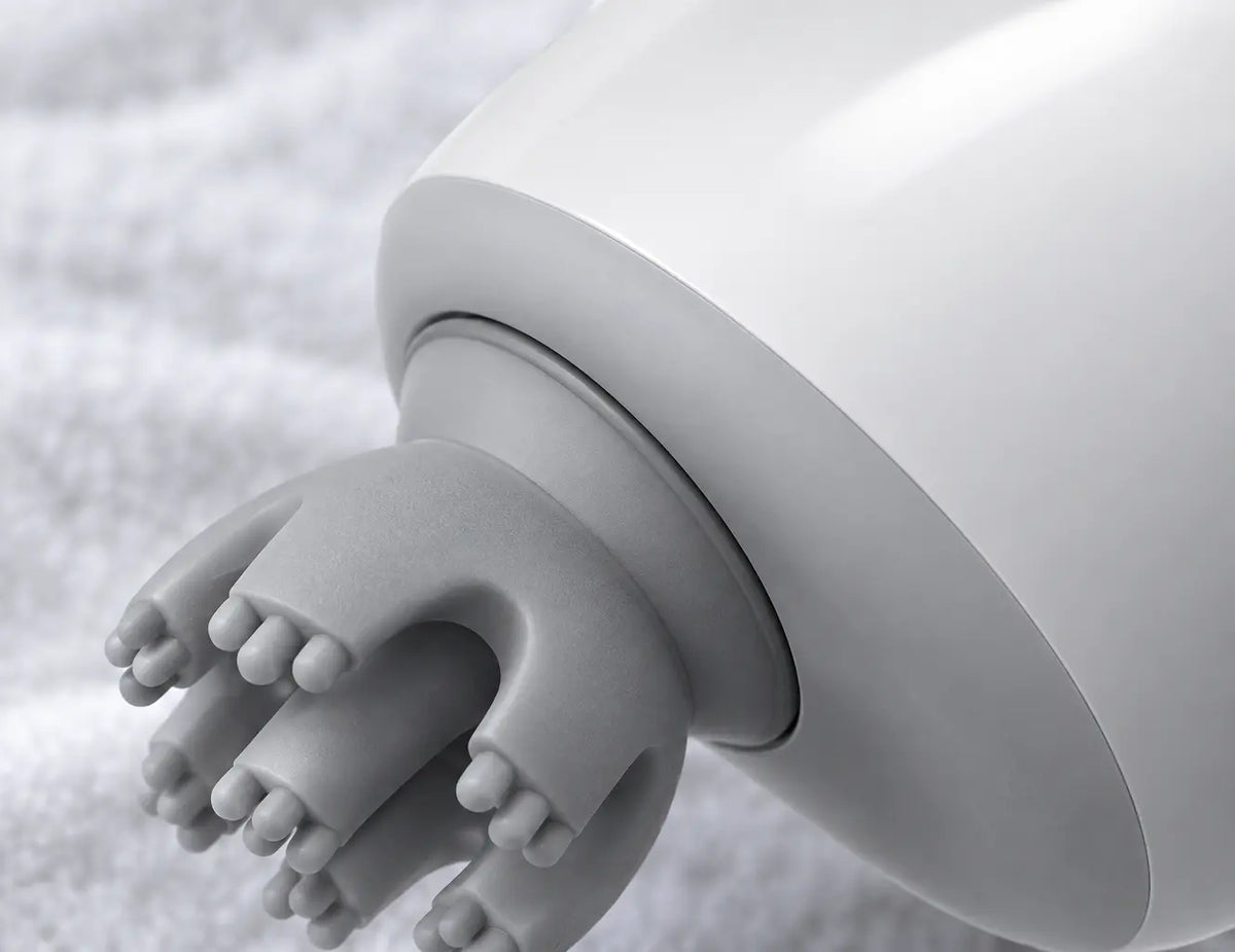 A very close side macro of the exact Nuage massager, focused on the real join between the smooth whi